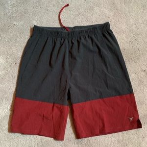 Black and red athletic shorts/ swim trunks